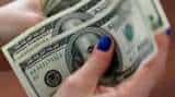US dollar rises on ease in US-Iran tension