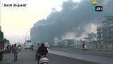 Fire fighters wrestle to control Surat market blaze Fire fighters wrestle to control Surat market blaze