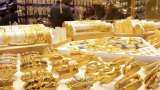 Gold falls 1 pct as global stimulus hopes boost risk assets