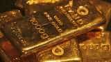 Gold slips from four-week high as dollar, equities firm on coronavirus slowdown
