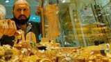 Gold firms on softer dollar, concerns over rising virus cases