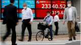 Global shares edge up on news Trump signs aid bill