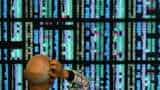 Asian shares make guarded gains as bond yields, resources spike