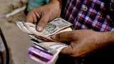 Rupee pares initial losses to close 11 paise up at 74.12 against USD