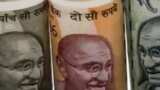 Rupee plummets 54 paise to close at 74.98 against US dollar