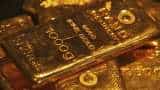 Gold edges down as investors cautiously eye Fed verdict