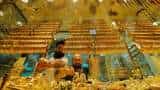 Gold Price Today: Yellow metal trades flat above Rs 48,000; buy on dips: Experts