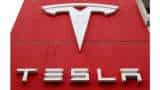 Tesla delivers record 936,172 vehicles in 2021, beats estimates