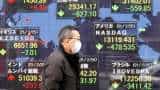 Asian shares fall on Fed officials&#039; hawkish policy stance