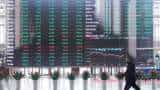 Asian shares, U.S. futures slide as traders fret about Ukraine, rate rises