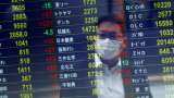 Asian shares decline, as US treasury yields hold firm after US inflation data