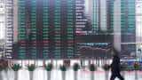 Asian stocks dip, oil skids on Shanghai shutdown