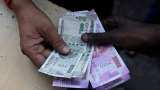 Rupee surges by 19 paise to 75.97 against US dollar