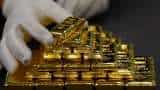 Gold subdued as stronger dollar counters Ukraine risks