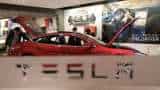 Tesla beats revenue, profit estimates on record deliveries