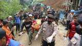 Indonesian rescuers search through the rubble of quake; 268 dead