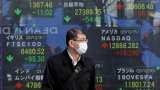 Asian stocks ease, dollar subdued as investors tread with caution
