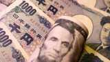 Dollar index hits two-week high as data boosts Fed hike expectations