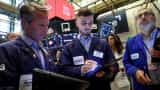 Wall Street ends slightly higher in shortened session, Tesla jumps