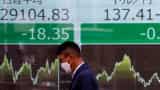 Asian shares rise, dollar dips as traders await US inflation data