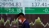 Asian shares rise, dollar dips as traders await US inflation data