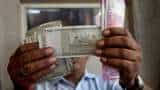 Rupee settles flat at 82.03 against US dollar