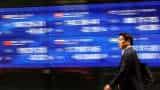 Asian shares climb after Fed hikes as expected; eyes on Europe, Japan