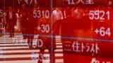 Asian shares hesitant after Wall Street sell-off, dollar buoyant