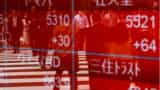 Asian shares hit two-week high on Fed pause bets, China boost