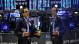Wall Street gains, dollar softens as weak data signals Fed pause