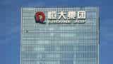 China Evergrande shares tumble 25% after wealth management staff detained