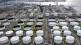 Oil rises on US crude draws, tight global supply