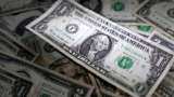 Dollar sticks near 10-month high, keeping heat on yen