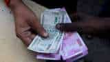 Indian rupee drops to record low, tracking Asian peers