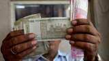 Rupee gains by 7 paise to end at 83.30 against US dollar