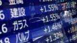 Asian stocks rise with year-end cheer; dollar heavy
