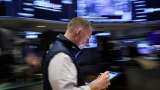 Wall Street ends mostly lower as chipmakers ease; inflation data ahead