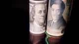 Dollar firm after Fed comments; yen under close watch
