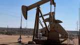 Oil holds onto gains as investors bet on tighter supply