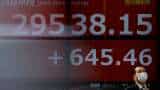 Asian markets news: Shares up, dollar firms as rate cut wagers fade