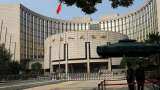 China central bank keeps policy rate unchanged, drains cash from banking system