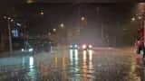 Downpours affect expressways, flights in China