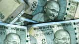 Rupee settles on a flat note near all-time low at 84.84 against US dollar