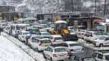 Heavy snowfall disrupts life in Kashmir; Flights, rail services suspended, Jammu-Srinagar highway closed