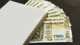 Rupee plunges 14 paise to close at record low of 87.57 against US dollar 