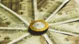 Rupee gains 2 paise to close at 87.19 against US dollar
