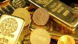 Gold prices tumble over Rs 850 as traders await US trade clarity; Silver down marginally