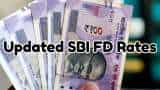 Revised SBI FD Rates: As State Bank of India cuts FD rates on 3 tenures, here's how much lower maturity you will get on Rs 1 lakh-Rs 50 lakh deposits Revised SBI FD Rates: As State Bank of India cuts FD rates on 3 tenures, here's how much lower maturity you will get on Rs 1 lakh-Rs 50 lakh deposits