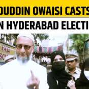 Asaduddin Owaisi casts his vote at a polling booth in Hyderabad during local elections