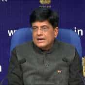 Union Minister Piyush Goyal hands over keys of new homes for 91 slum swellers displaced by road project in Mumbai